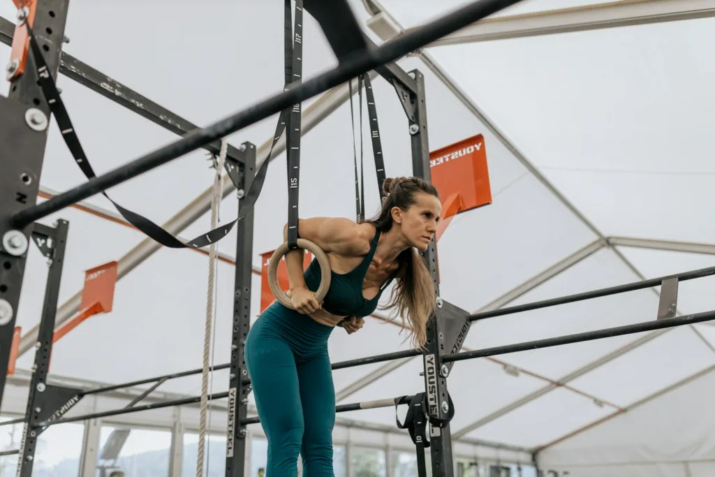 A woman in the U.S. performing resistance exercises with gymnastic rings, a great workout for weight loss and building strength.