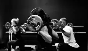 three person lifting barbels under Strength Training in San Francisco.