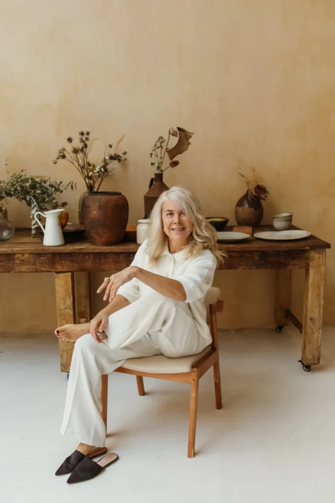 An American Senior woman sitting comfortably, embracing gentle exercises for relaxation and well-being in her golden years.