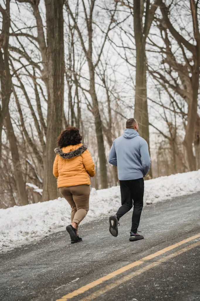 Americans enjoying a brisk winter walk, showcasing an easy and effective way to stay active and lose weight.